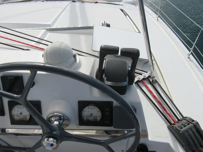 Lady Ana Yacht Photos Pics Steering wheel and controls of a 2020 Bali 4.1 yacht, featuring navigation instruments.