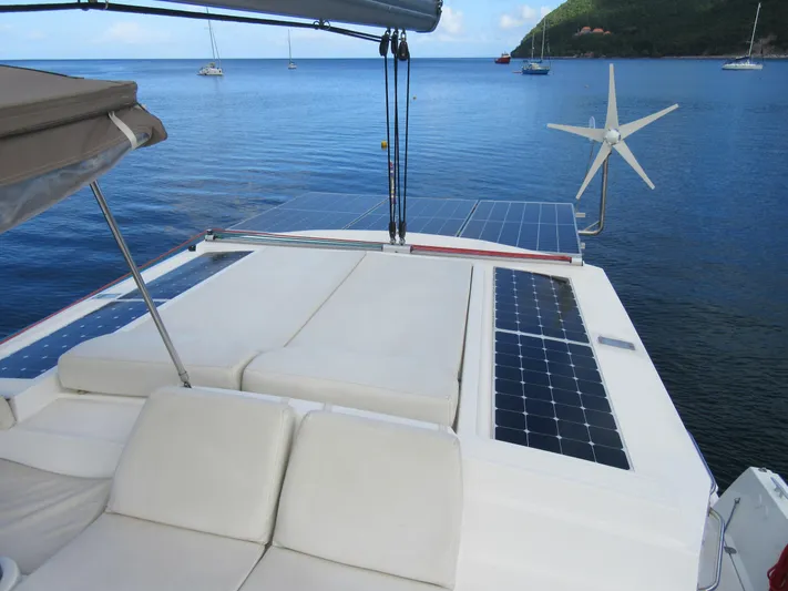 Lady Ana Yacht Photos Pics Catamaran Bali 4.1 (2020) with solar panels and wind turbine on calm sea.