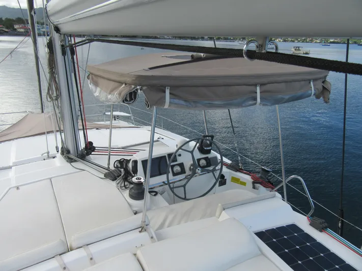 Lady Ana Yacht Photos Pics Sailing yacht Bali 4.1, 2020 model, featuring helm station and canopy on calm waters.