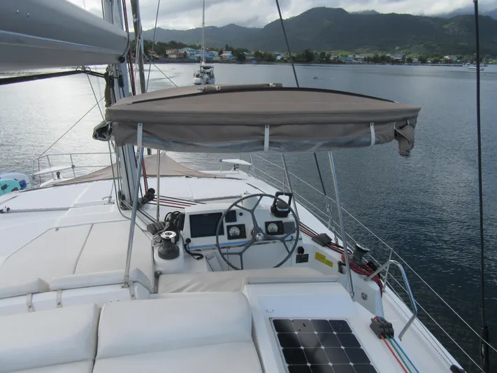 Lady Ana Yacht Photos Pics 2020 Bali 4.1 catamaran helm with canopy, docked in scenic harbor.