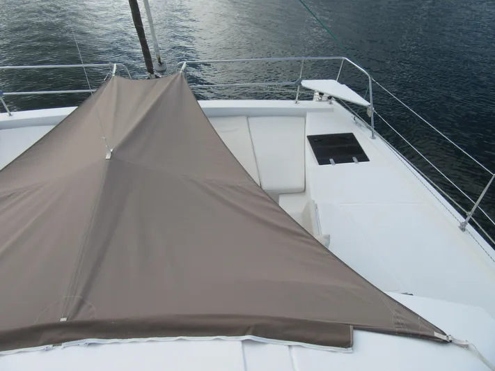 Lady Ana Yacht Photos Pics Bali 4.1 catamaran deck with sunshade, 2020 model, on calm water.