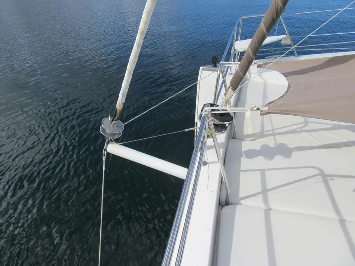 Lady Ana Yacht Photos Pics Bali 4.1 catamaran deck view, 2020 model, with sail rigging over calm water.