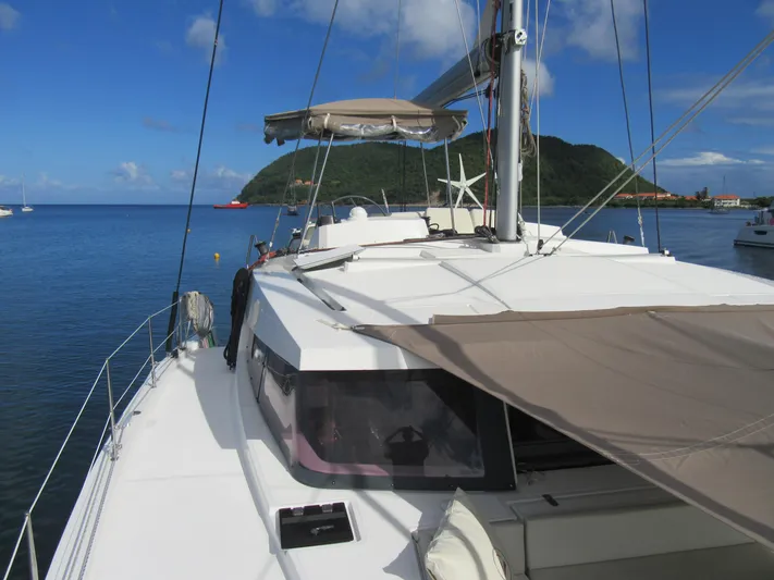 Lady Ana Yacht Photos Pics Sailing catamaran Bali 4.1, 2020 model, anchored in scenic bay with lush hills.