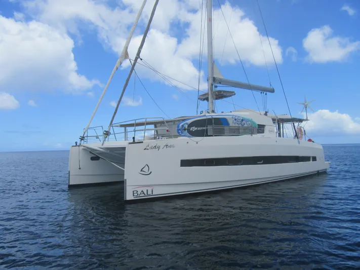 Lady Ana Yacht Photos Pics Sailing catamaran Bali 4.1, 2020 model, on calm ocean under blue sky.