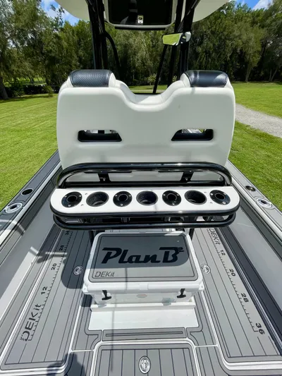  Yacht Photos Pics 2021 Orion 29CC boat interior with rod holders and "Plan B" DEKit flooring.