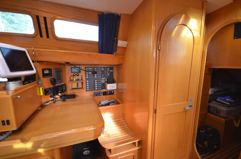 Monica Yacht Photos Pics 2006 Alubat Ovni 395 Centerboard interior with navigation station and wooden cabinetry.