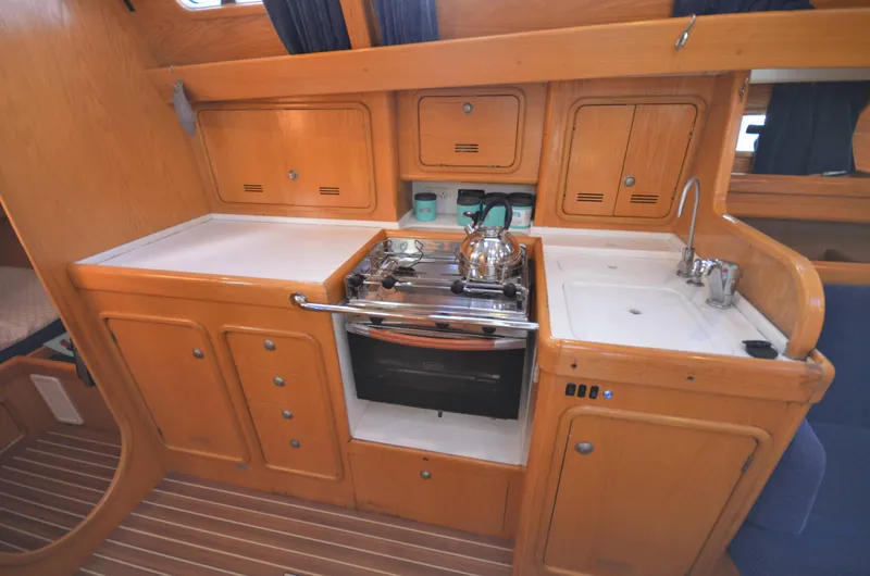 Monica Yacht Photos Pics Interior of 2006 Alubat Ovni 395 Centerboard yacht kitchen with stove and sink.