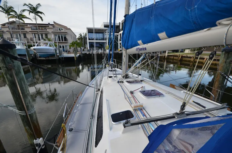 Monica Yacht Photos Pics 2006 Alubat Ovni 395 Centerboard sailboat docked near waterfront homes.