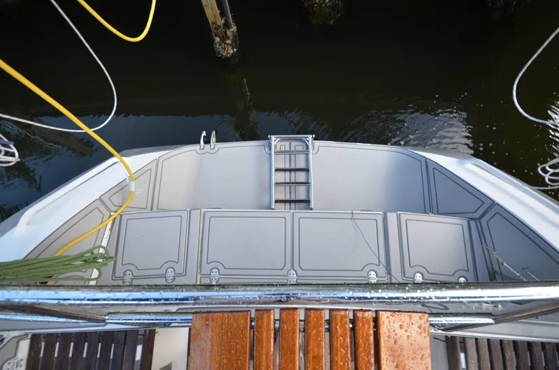 Monica Yacht Photos Pics Stern view of 2006 Alubat Ovni 395 Centerboard sailboat with ladder and dock lines.