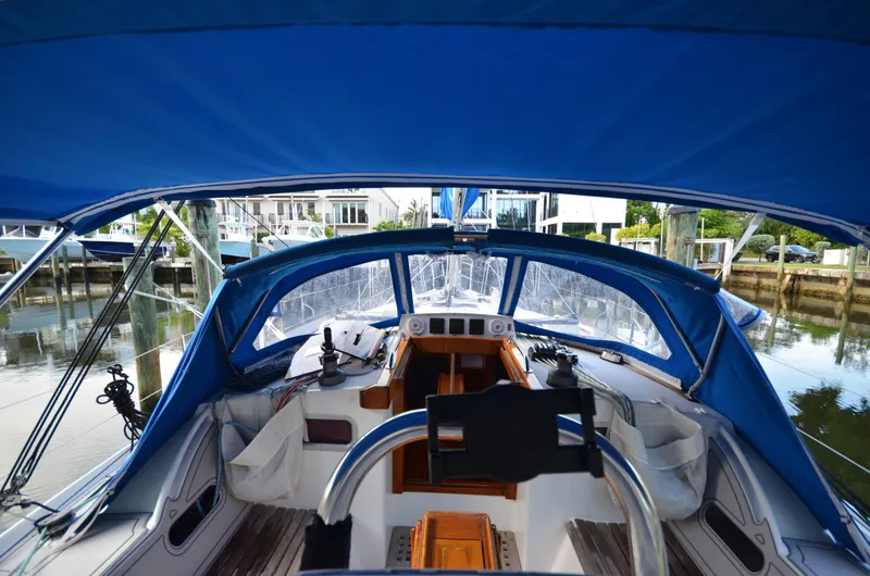 Monica Yacht Photos Pics Cockpit view of 2006 Alubat Ovni 395 Centerboard sailboat with blue canopy.