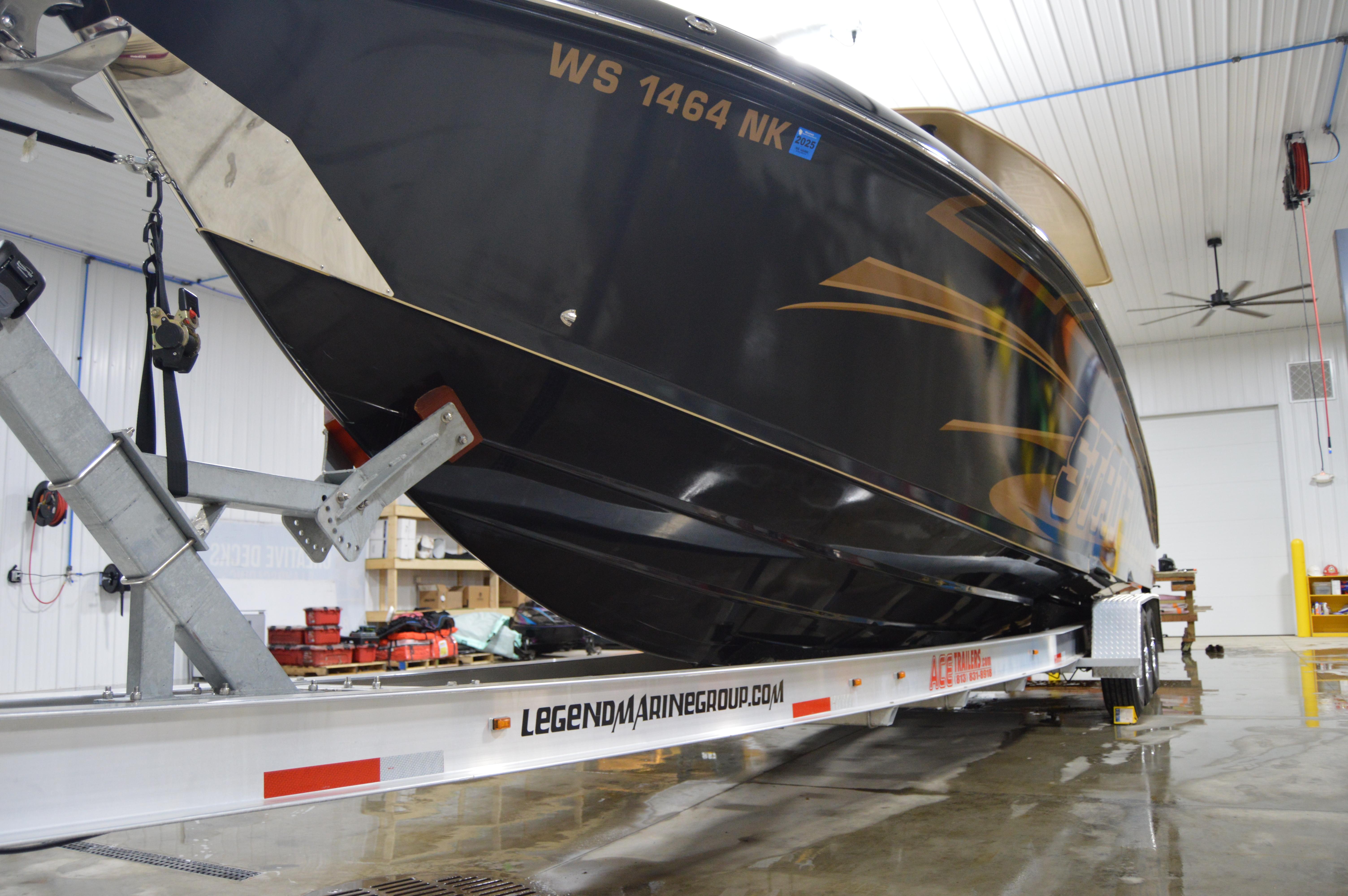 2017 Statement 380 Open boat on trailer in indoor storage facility.