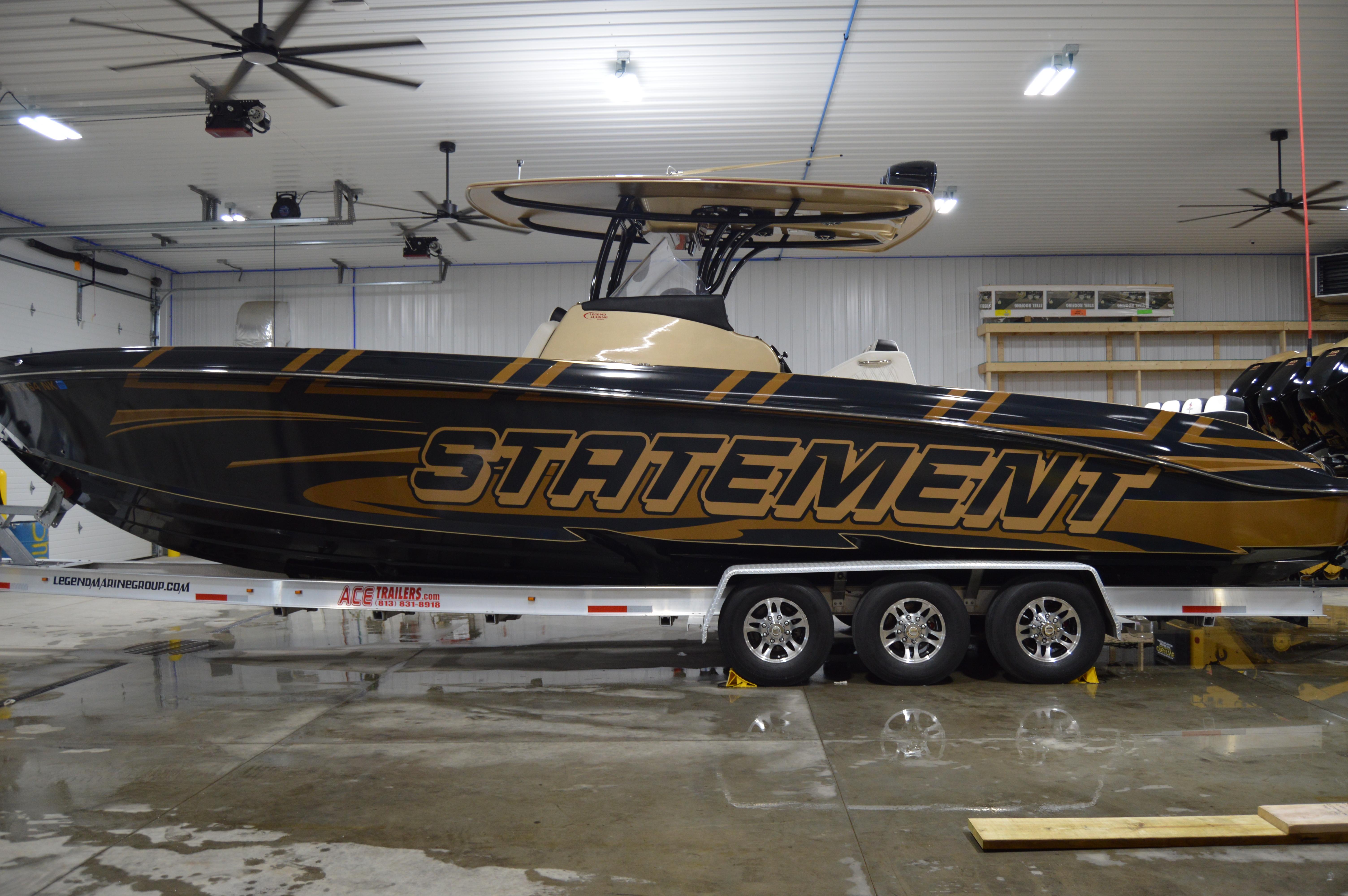 2017 Statement 380 Open boat in a garage, on a triple-axle trailer.