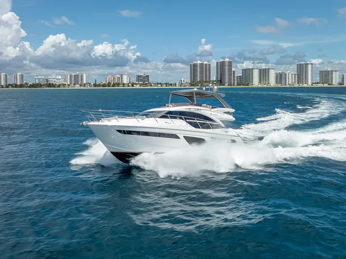  Yacht Photos Pics Luxury Princess F55 yacht cruising on blue ocean near city skyline, 2018 model.