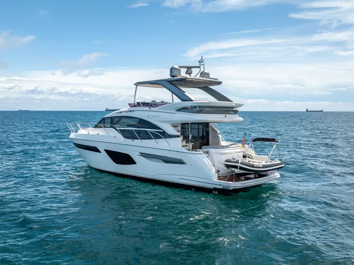  Yacht Photos Pics Luxury 2018 Princess F55 yacht cruising on open sea under clear skies.