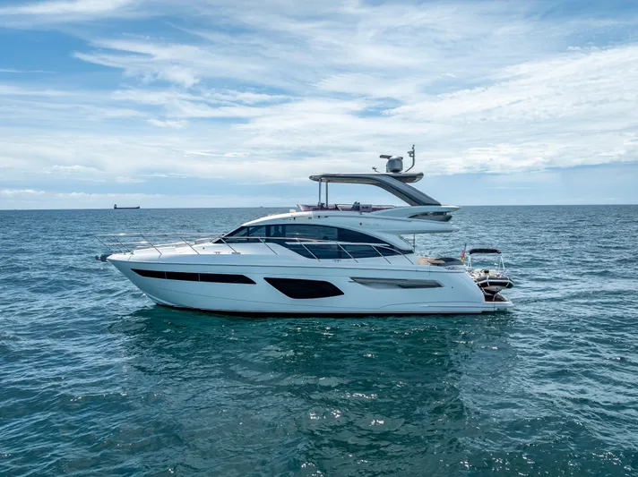  Yacht Photos Pics 2018 Princess F55 yacht cruising on open sea under a partly cloudy sky.