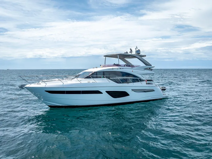  Yacht Photos Pics Luxury 2018 Princess F55 yacht cruising on open sea under clear sky.