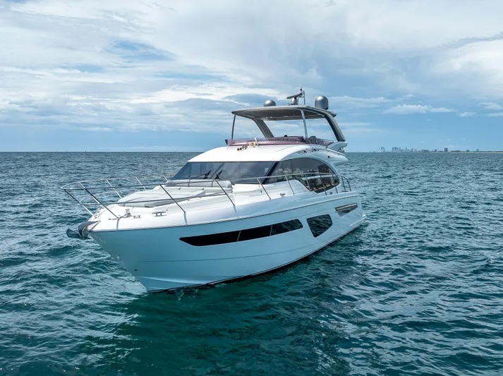  Yacht Photos Pics 2018 Princess F55 yacht cruising on open sea under cloudy sky.