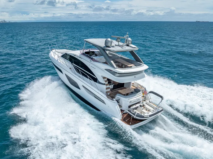  Yacht Photos Pics Luxurious 2018 Princess F55 yacht cruising on open sea, showcasing sleek design and elegance.