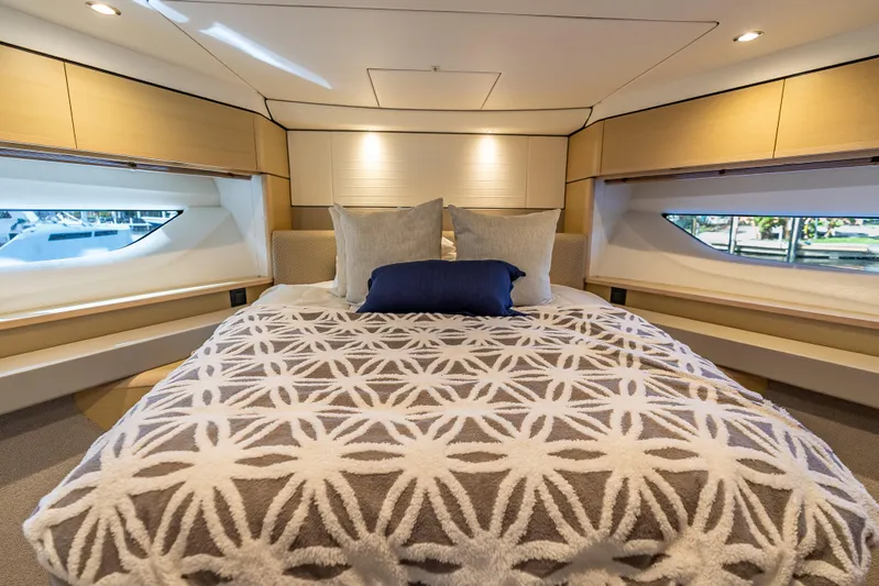  Yacht Photos Pics Luxurious bedroom interior of 2018 Princess F55 yacht with elegant bedding and modern design.