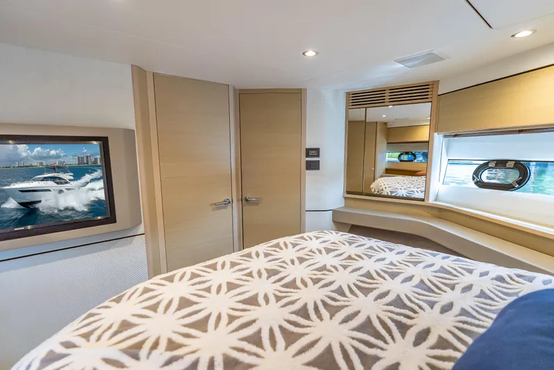  Yacht Photos Pics Luxurious 2018 Princess F55 yacht bedroom with modern decor and scenic window view.
