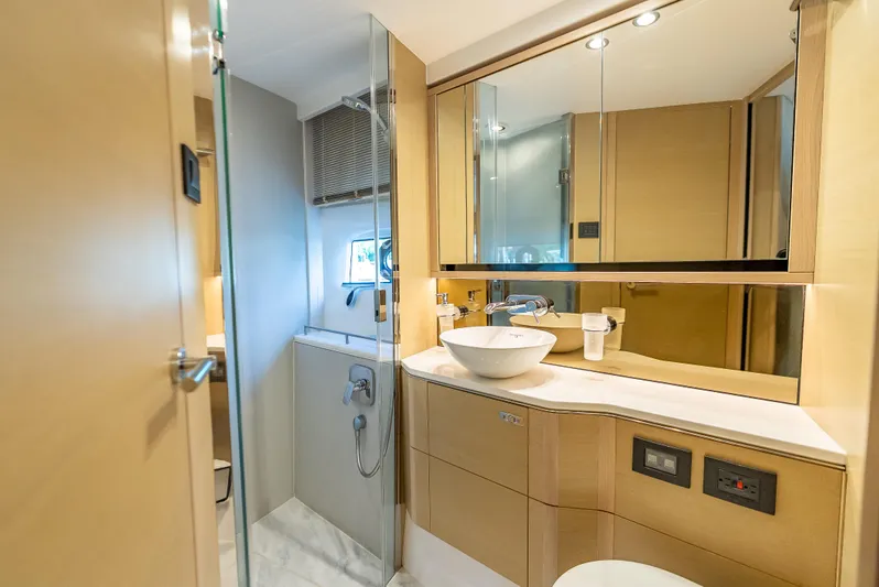  Yacht Photos Pics Luxurious bathroom interior of 2018 Princess F55 yacht with modern fixtures and elegant design.