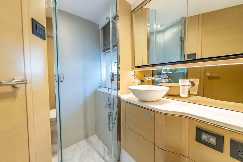  Yacht Photos Pics Luxurious bathroom in 2018 Princess F55 yacht with modern fixtures and elegant design.
