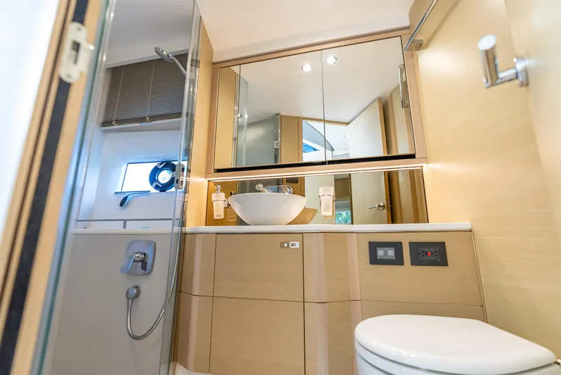  Yacht Photos Pics Luxurious bathroom interior of 2018 Princess F55 yacht with modern fixtures and elegant design.
