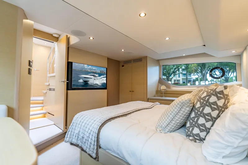  Yacht Photos Pics Luxurious 2018 Princess F55 yacht bedroom with modern decor and large window view.