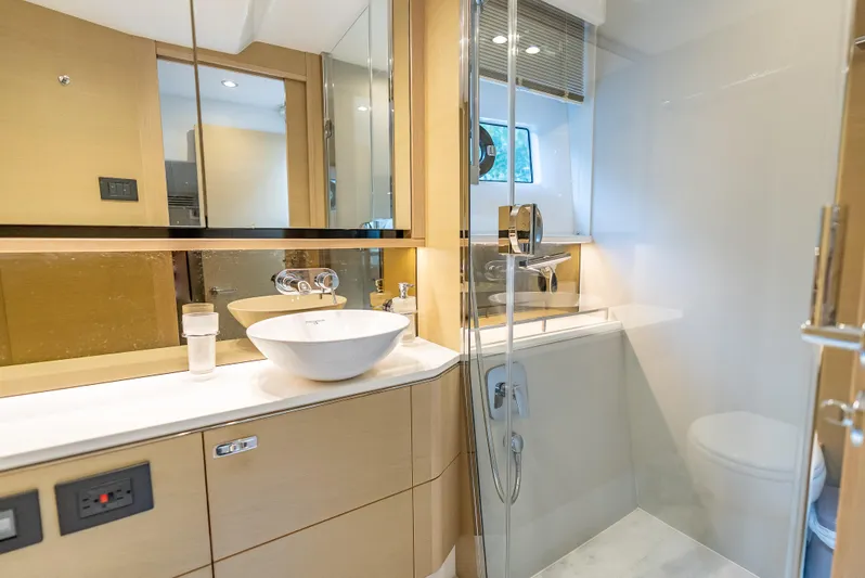  Yacht Photos Pics Luxurious bathroom interior of 2018 Princess F55 yacht with modern fixtures and elegant design.