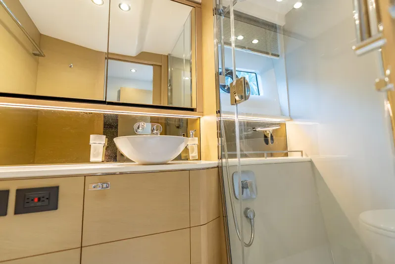  Yacht Photos Pics Luxurious bathroom in 2018 Princess F55 yacht with modern fixtures and elegant design.