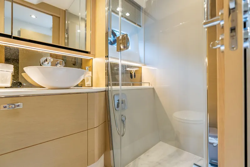  Yacht Photos Pics Luxurious bathroom in 2018 Princess F55 yacht with modern fixtures and elegant design.