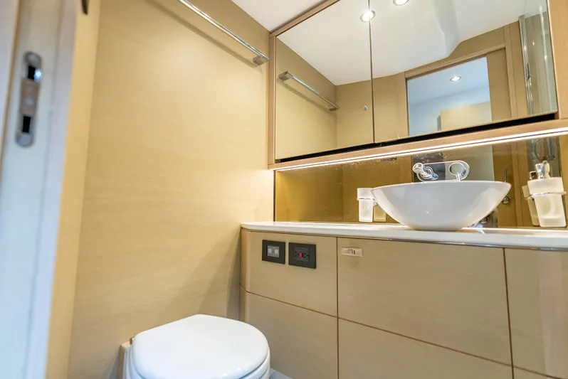  Yacht Photos Pics Luxurious bathroom in 2018 Princess F55 yacht with modern sink and mirror.