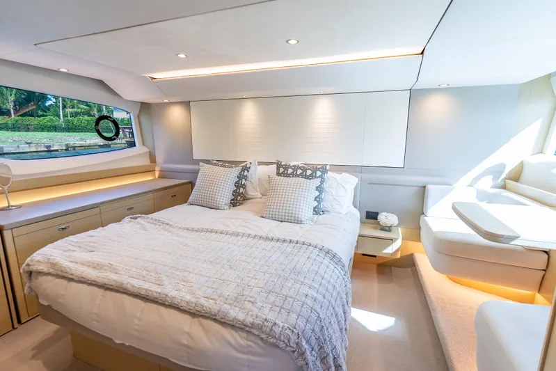  Yacht Photos Pics Luxurious bedroom interior of 2018 Princess F55 yacht with elegant decor and natural light.