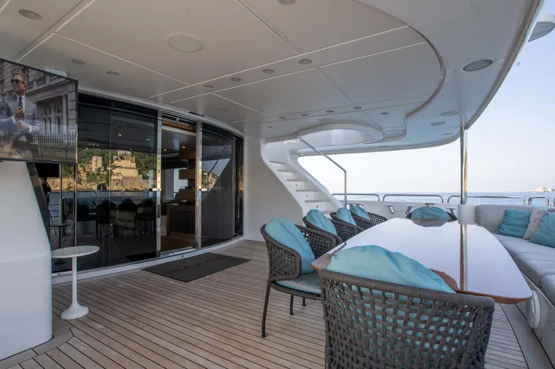 Safad Yacht Photos Pics Luxury deck of 2015 Benetti 121 yacht with outdoor seating and TV.