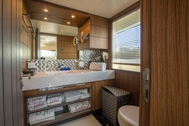 Safad Yacht Photos Pics Luxurious bathroom on a 2015 Benetti 121 yacht with modern wood finishes.