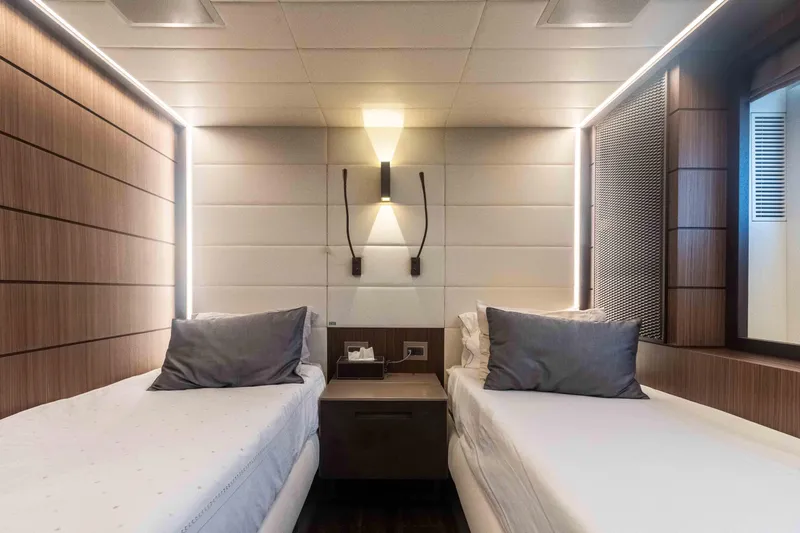 Safad Yacht Photos Pics Modern twin bedroom on 2015 Benetti 121 yacht with sleek lighting and wooden accents.