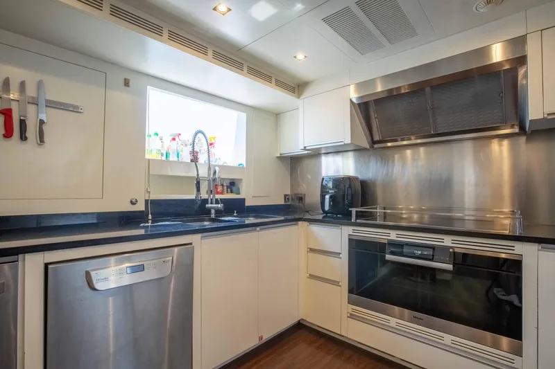 Safad Yacht Photos Pics Modern kitchen in a 2015 Benetti 121 yacht with stainless steel appliances.