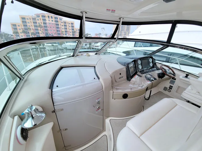  Yacht Photos Pics 2009 Sea Ray 44 Sundancer helm with modern controls and panoramic windows.