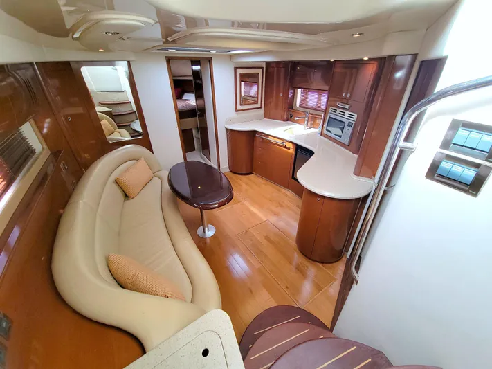  Yacht Photos Pics Luxurious interior of a 2009 Sea Ray 44 Sundancer yacht with elegant wood finishes.