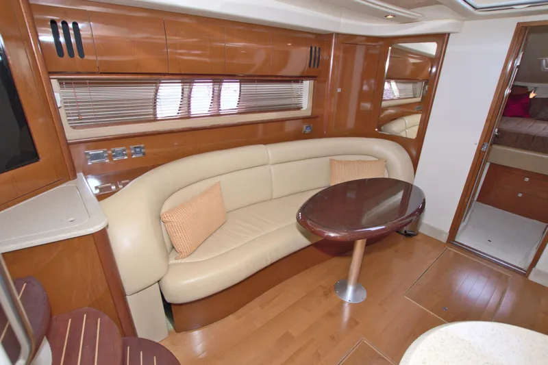  Yacht Photos Pics Luxurious interior of 2009 Sea Ray 44 Sundancer yacht with elegant seating and table.