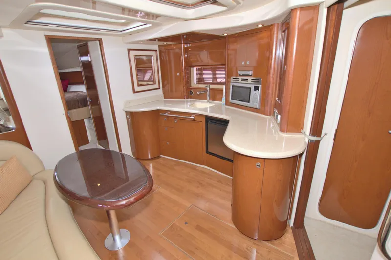  Yacht Photos Pics 2009 Sea Ray 44 Sundancer yacht interior with modern kitchen and seating area.