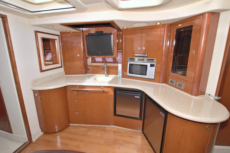  Yacht Photos Pics Luxurious kitchen interior of 2009 Sea Ray 44 Sundancer yacht with modern appliances.
