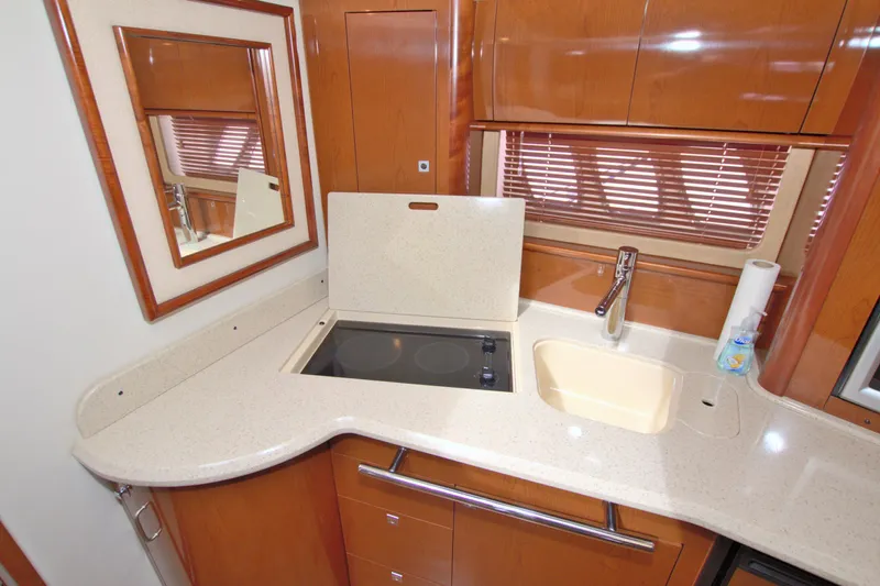  Yacht Photos Pics 2009 Sea Ray 44 Sundancer yacht kitchen with sleek countertops and modern fixtures.