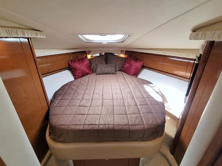  Yacht Photos Pics Luxurious cabin interior of 2009 Sea Ray 44 Sundancer yacht with cozy bedding.