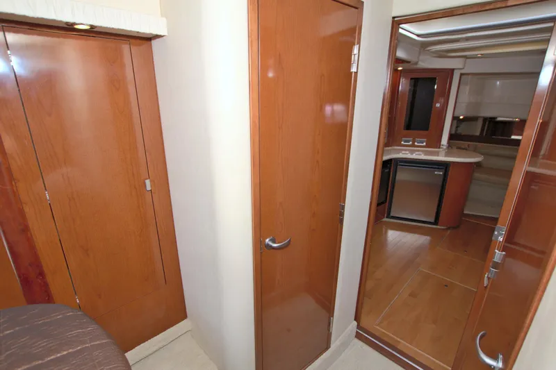  Yacht Photos Pics Interior view of 2009 Sea Ray 44 Sundancer yacht with wooden cabinetry and modern design.