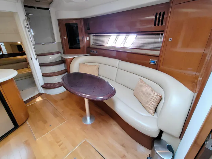  Yacht Photos Pics Interior of 2009 Sea Ray 44 Sundancer yacht with elegant seating and wooden finishes.