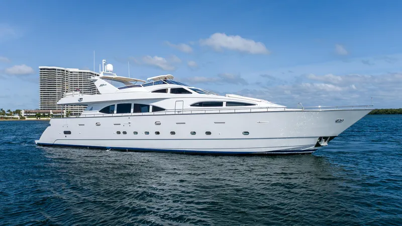  Yacht Photos Pics Luxurious 1999 Azimut 100 Jumbo yacht on serene blue waters, showcasing elegant design.