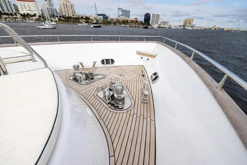  Yacht Photos Pics Luxurious 1999 Azimut 100 Jumbo yacht deck with sleek wood finish and ocean view.