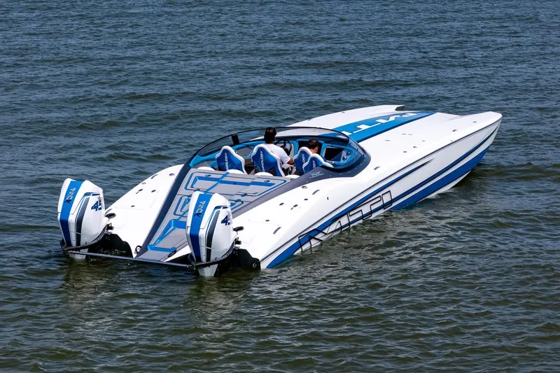 El Gato Yacht Photos Pics 2022 MTI 390X speedboat with dual outboard engines on open water.