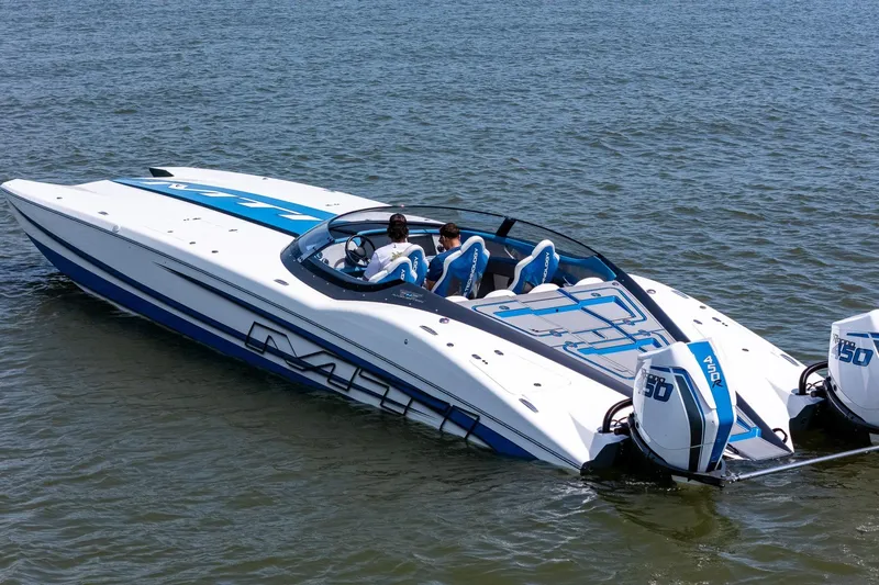 El Gato Yacht Photos Pics 2022 MTI 390X speedboat on water, featuring dual Mercury 450R engines.